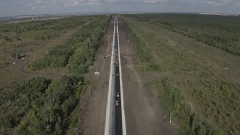 Copter flies over road repairs in Russia Stock Footage 151252736