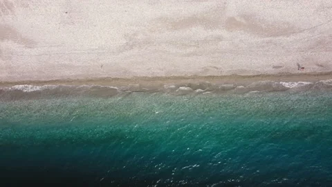 Copter flies over seashore, border of the sea and the coast is divided in half Stock Footage 180675049