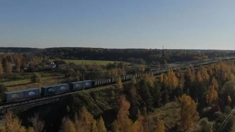 The copter flies into the sky capturing the train Stock Footage 164318761