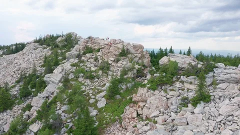 Copter flies to the top of the mountain. Stock Footage 114058331