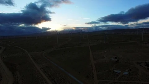 Copter flight over field with windmills generating power Stock Footage 79165292