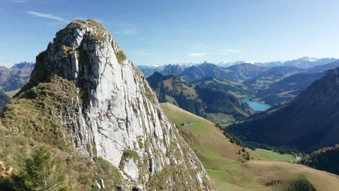 Copter flight through a mountain range to a lake Lac de l'Hongrin in Switzerland Stock Footage 123857518