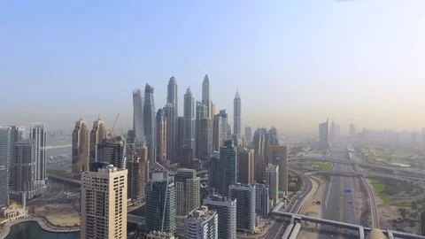 Copter fly beside with roads and skyscrapers of Dubai Stock Footage 75519404
