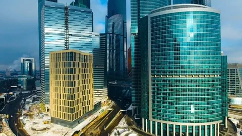 Copter flying down the skyscraper in Moscow-city area. Moscow International Stock-Footage 73036348
