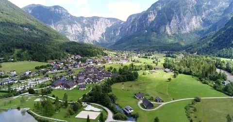 The copter is flying over the beautiful small village in the mountains of Stock Footage 82243197