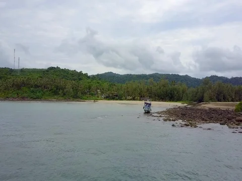 Copter Flying Over boat on a stone aground Ko Kut Island Mainly cloudy Stock Footage 75985571