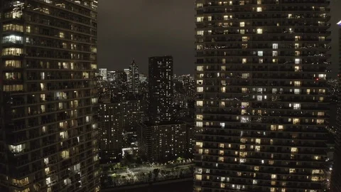 Off the copter in front of residential skyscrapers overlooking the night Tokyo Stock Footage