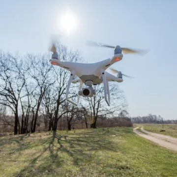 Copter with high resolution digital camera in flight Stock Photos