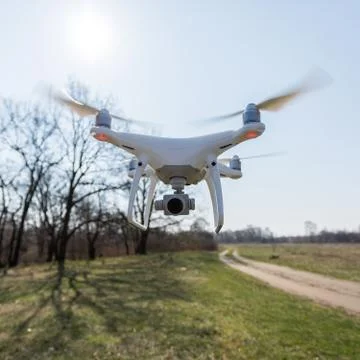 Copter with high resolution digital camera in flight Stock Photos