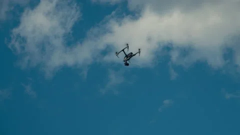 Copter Or Drone Flies Against The Blue Sky Stock Footage 155441397