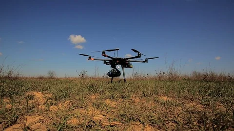 Copter stands in the field before take-off. Stock Footage 75862778