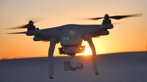 Copter at sunset in the desert Stock Footage 80095470