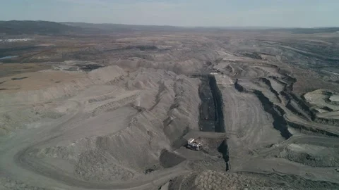 Copter view to Opened layer of coal in field. Extraction of raw materials for Stock Footage 203918816