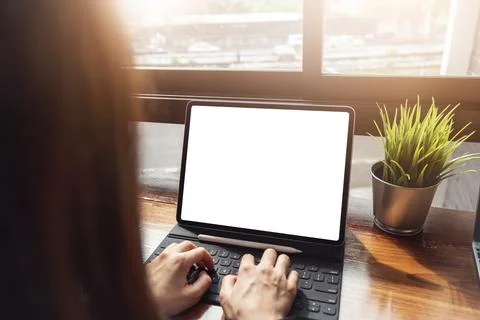 Copy Space concept, woman using computer tablet pro at cafe. technology for.. Stock Photos
