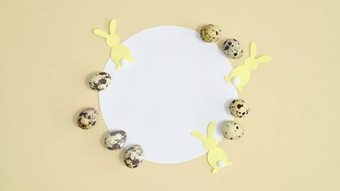 Copy space decorated with quail eggs and rabbits. Stop motion flat lay Stock Footage 171444837