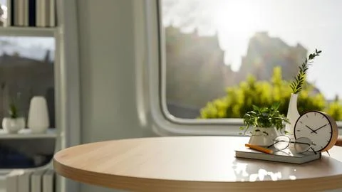 A copy space for displaying products on a round wooden table in a modern br.. Illustrazione stock