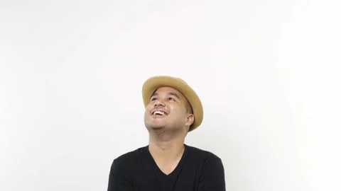 Copy Space, Guy put on hat in casual clothes touching chin, scratching head whil Stock Footage 144651338