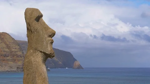COPY SPACE: Large volcanic sculpture with human features faces deep blue ocean. Stock Footage 111224593