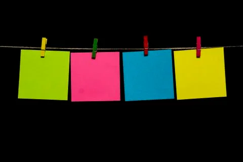 Copy space. Multicolored sheets of paper attached to a rope clothespins. Foto stock
