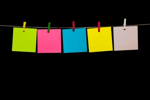 Copy space. Multicolored sheets of paper attached to a rope clothespins. 스톡 사진