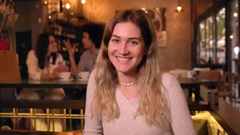 Copy space portrait of cheerful blonde girl at bar. European woman poses looking Stock Footage 244597635