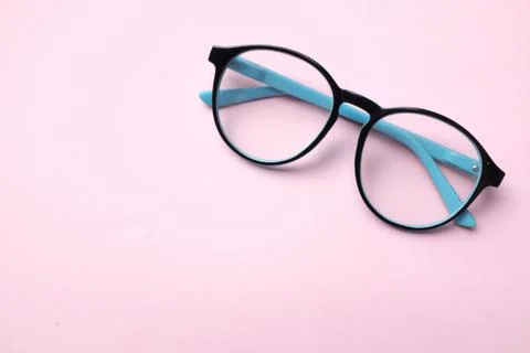 Copy space round black Eye Glasses isolate on a pink pastel Background Stock Photos