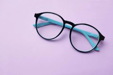 Copy space round black Eye Glasses isolate on a pink pastel Background Stock Photos