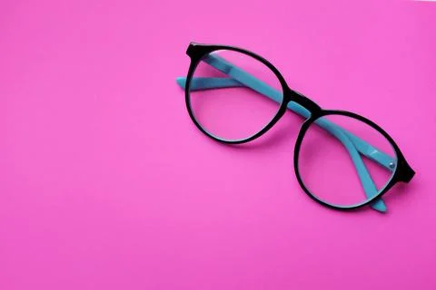 Copy space round black Eye Glasses isolate on a pink Background Stock Photos