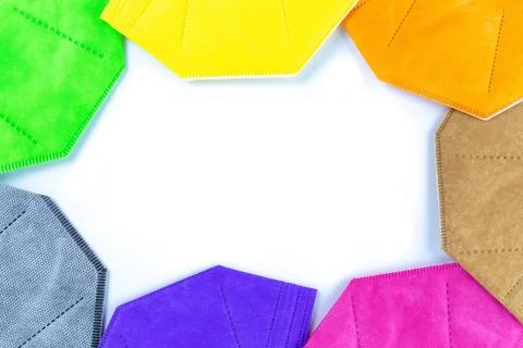 A Copy space round stack of  different colors face masks respirators Stockfoto's