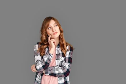 Copy Space for Text or Product . Stylish woman studio standing isolated on grey Stock Photos
