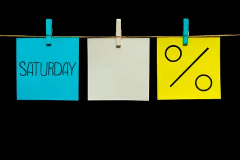 Copy space. Three stickers. On the left blue sheet inscription Saturday. In the Foto stock