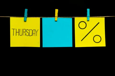 Copy space. Three stickers. On the left yellow sheet inscription Thursday. In 库存照片