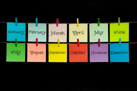 Copy space. Twelve multi-colored sheets with the names of the months of the year Stock Photos