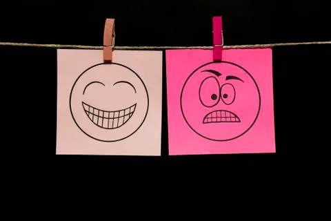 Copy space. Two multi-colored stickers with emoticons. Joy. Rage. Positive and Stock Photos