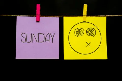 Copy space. Two multicolored stickers. On left a sheet inscription sunday. On Stock Photos