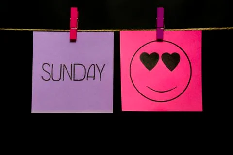 Copy space. Two multicolored stickers. On left a sheet inscription sunday. On Stock Photos