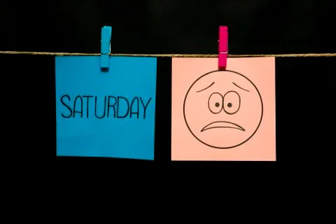 Copy space. Two multicolored stickers. On left a sheet inscription saturday. On Stock Photos