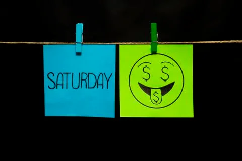 Copy space. Two multicolored stickers. On left a sheet inscription saturday. On Stock Photos