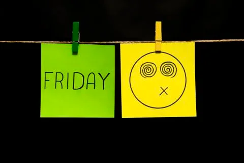 Copy space. Two multicolored stickers. On left a sheet inscription friday. On Stock Photos