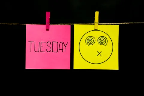 Copy space. Two stickers. On the left the inscription tuesday. On the yellow of Stock Photos