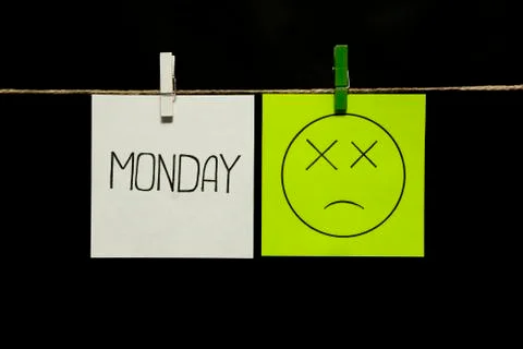 Copy space. Two stickers. Left on a white sheet inscription monday. On the Photos