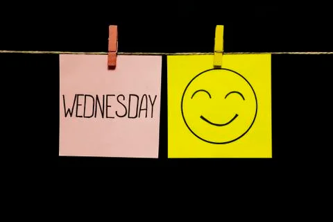 Copy space. Two stickers. Left on a white sheet inscription wednesday. On the Stock Photos