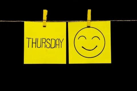 Copy space. Two stickers. Left on sheet inscription thursday. On the yellow Stock Photos