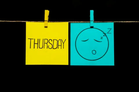 Copy space. Two stickers. Left on sheet inscription thursday. On the right on Stock Photos