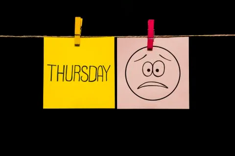 Copy space. Two stickers. Left on yellow sheet inscription thursday. On right Stock Photos