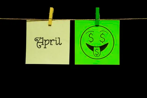 Copy space. Two stickers. On the left sheet inscription April. On the green Stock Photos