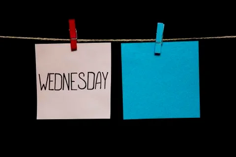 Copy space. Wednesday. Note is written on a white sticker. White and azure 库存照片