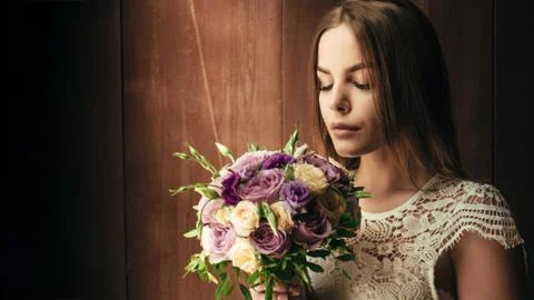 Copy space , your text here , girl holding flowers in hands, young beautiful  Stock Photos