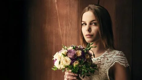 Copy space , your text here , girl holding flowers in hands, young beautiful  Stock Photos