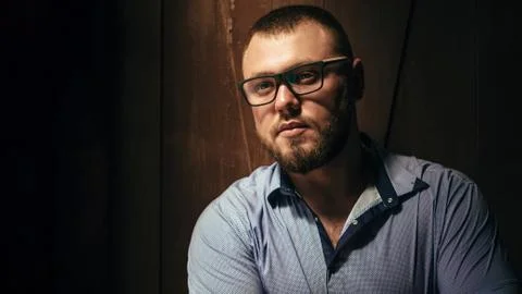 Copy space , your text here ,brutal bearded man with a tattoo on his arm, por Stock Photos